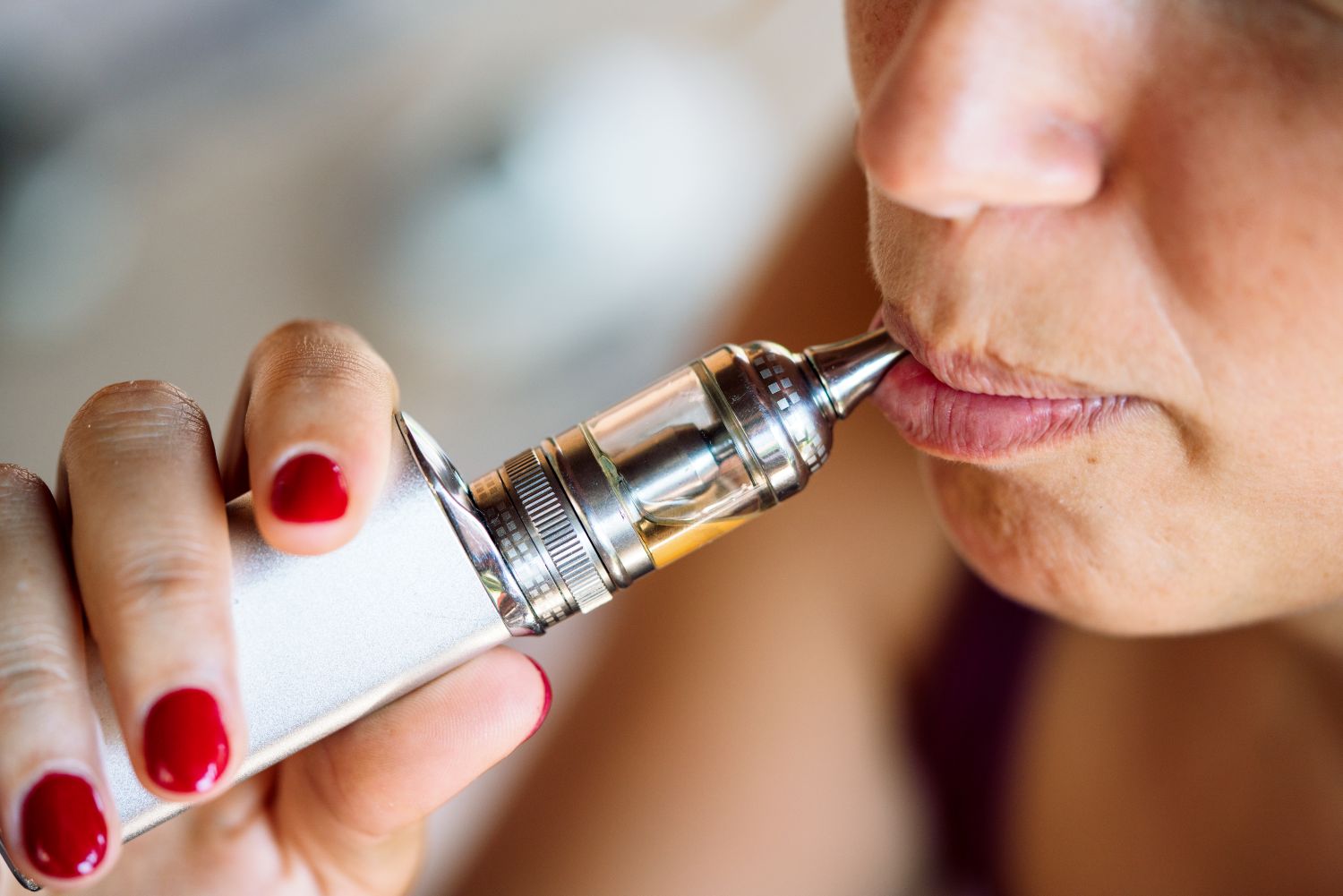 woman using e-cigarette